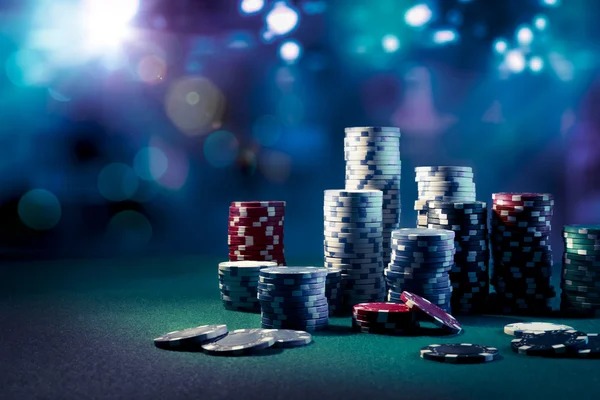 Live dealer rolling three dice in Sic Bo game
